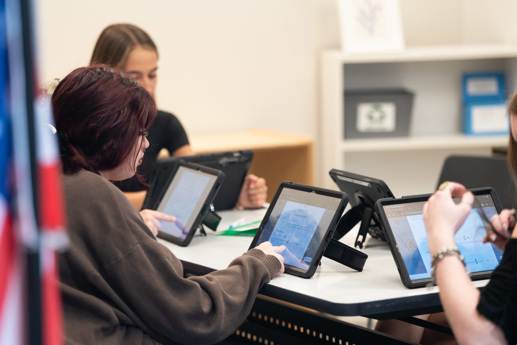 students working on an ipad