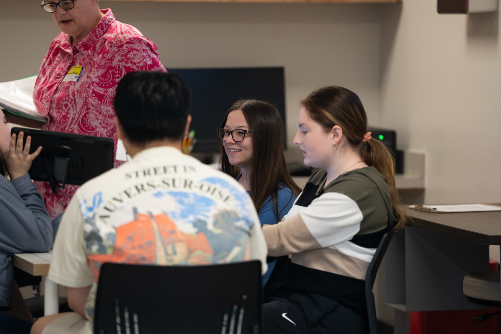 students laughing while completing an activity