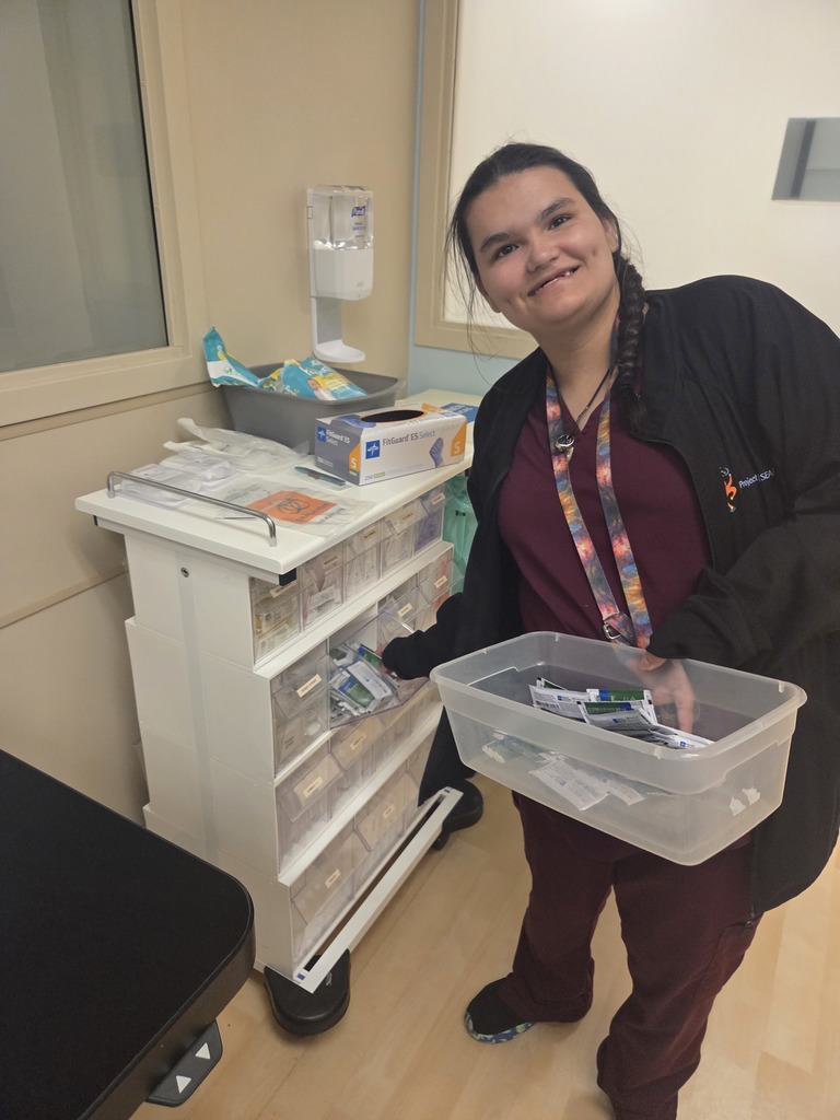 An intern stocking supplies