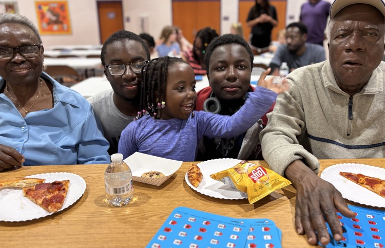 student with parents and grandparents at bingo 