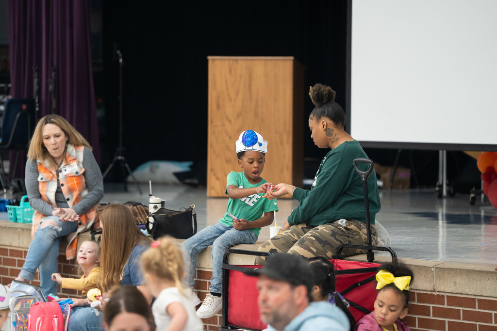 student and parent sitting at a lunch table