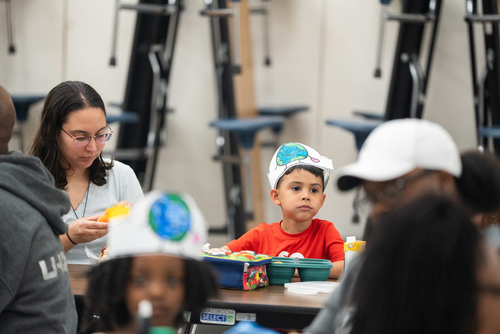 student and parent sitting at a lunch table