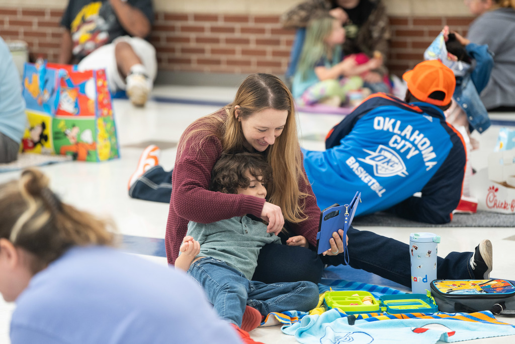 mom and child hugging on the floor