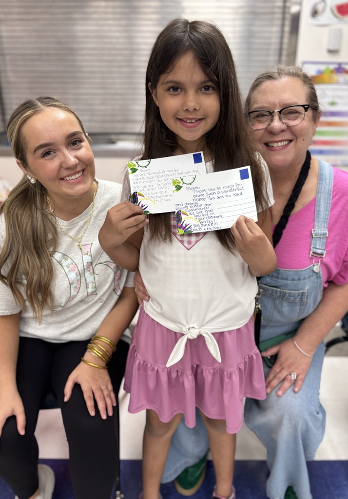 Mrs burlison and student teacher with a student 