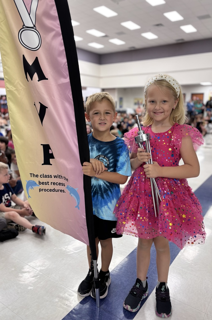 students holding mvp flag 
