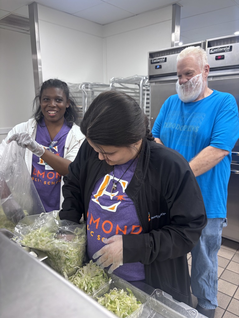 An intern preparing lettuce. 