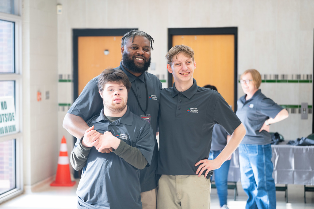 teacher and students posing for a photo
