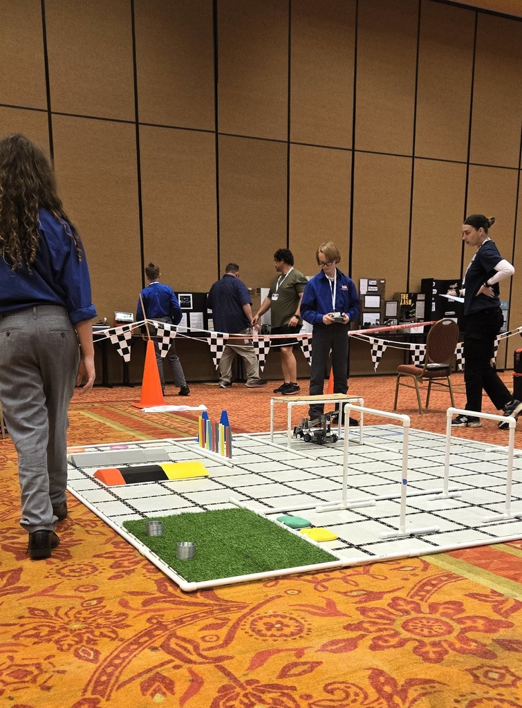 TSA members drive a robot through a course as part of TSA State Conference.