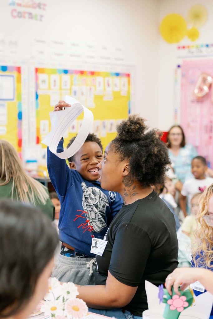boy giving his mom a crown