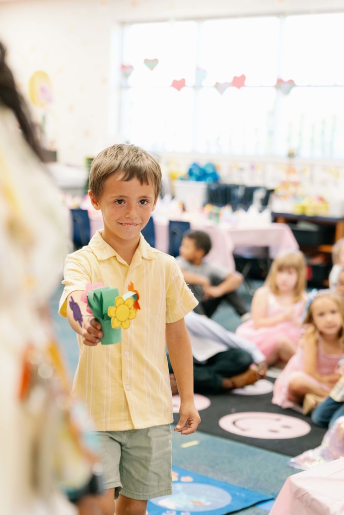 boy with handmade flowers
