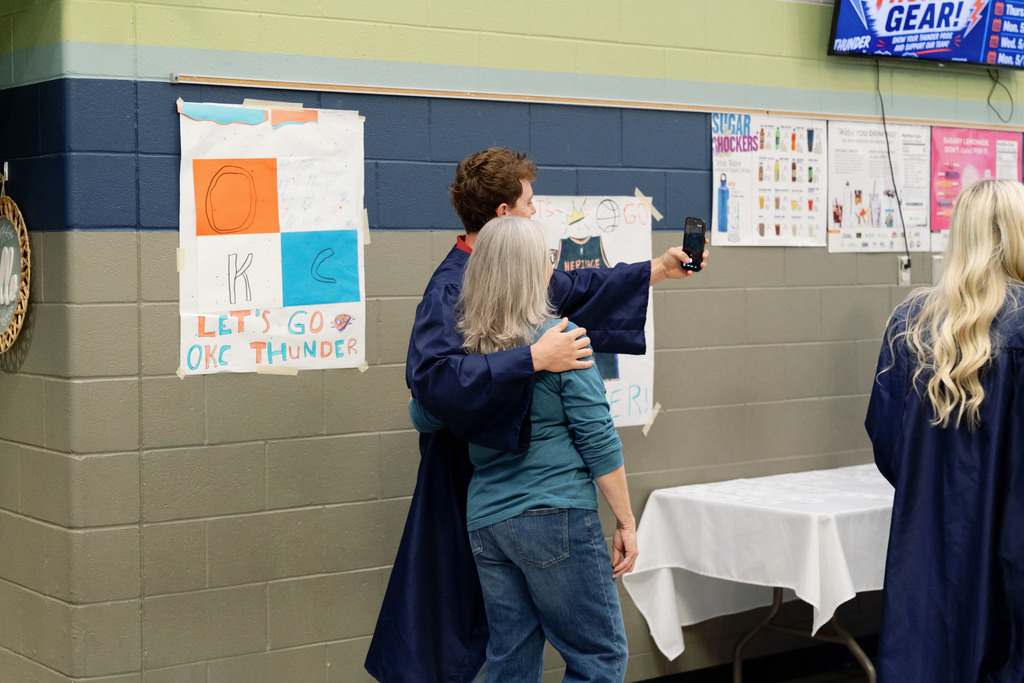 senior taking photo with a teacher