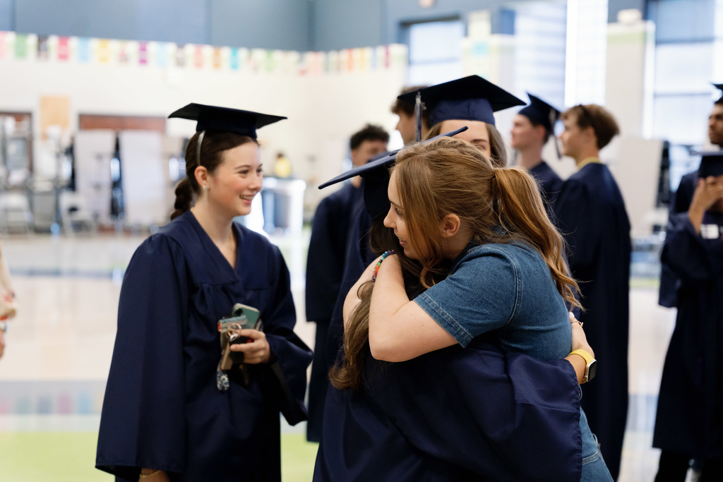 teacher hugging students
