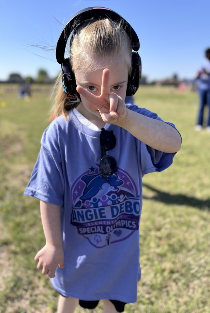 student showing a peace sign 