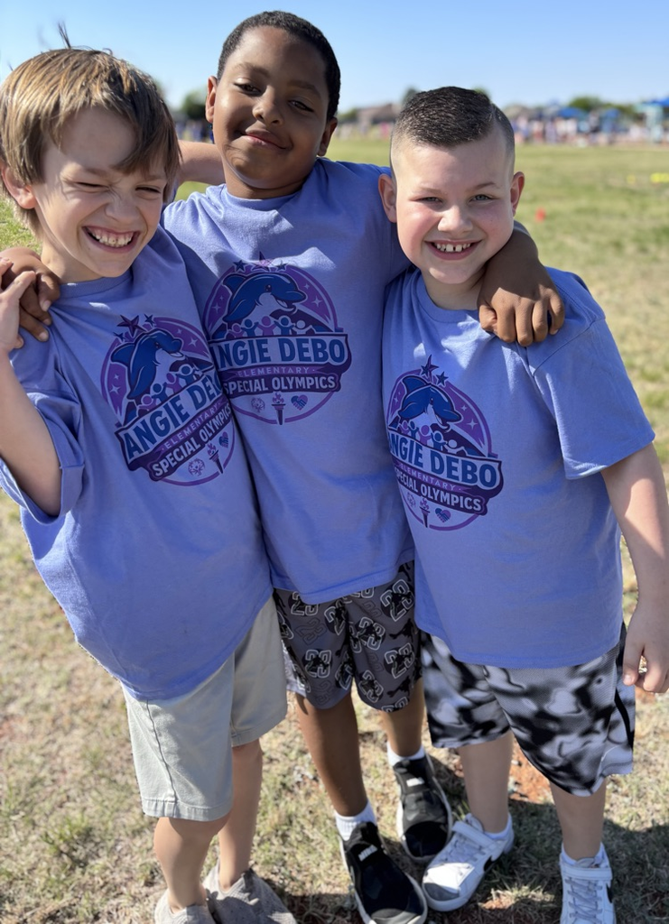 students smiling outside 