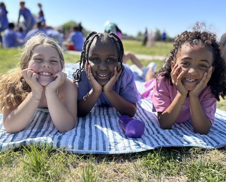 students smiling outside 