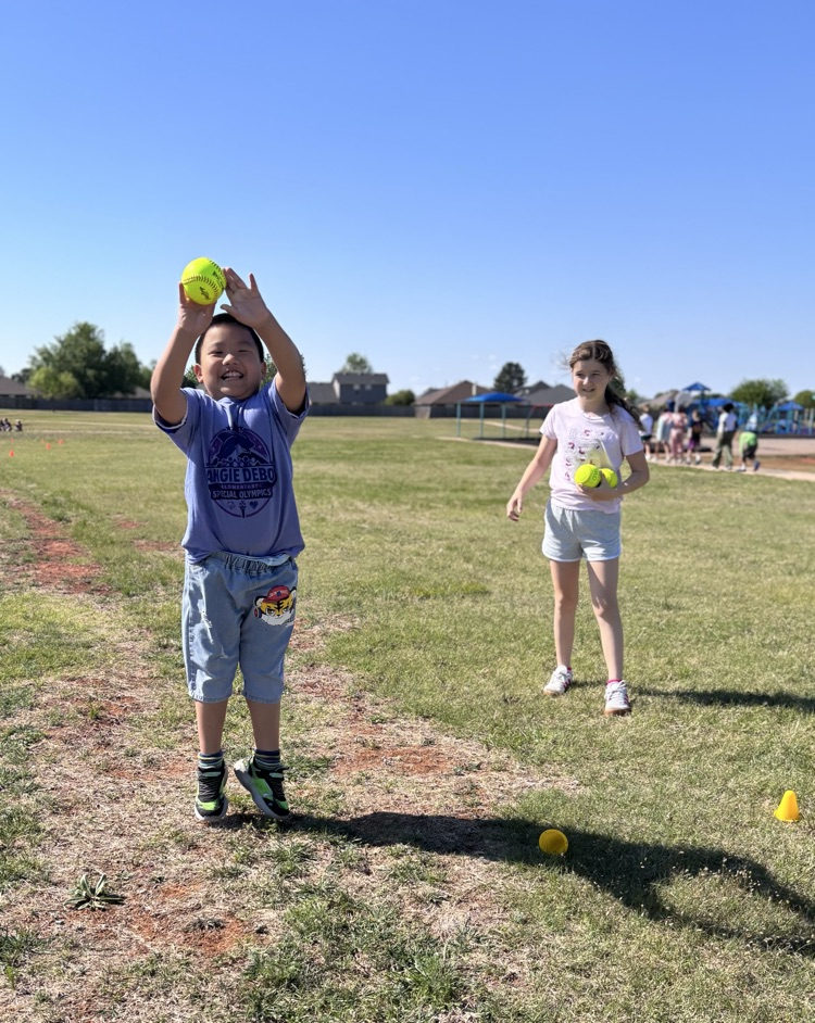 student throwing ball 