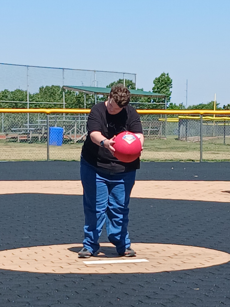 An intern pitching the ball.