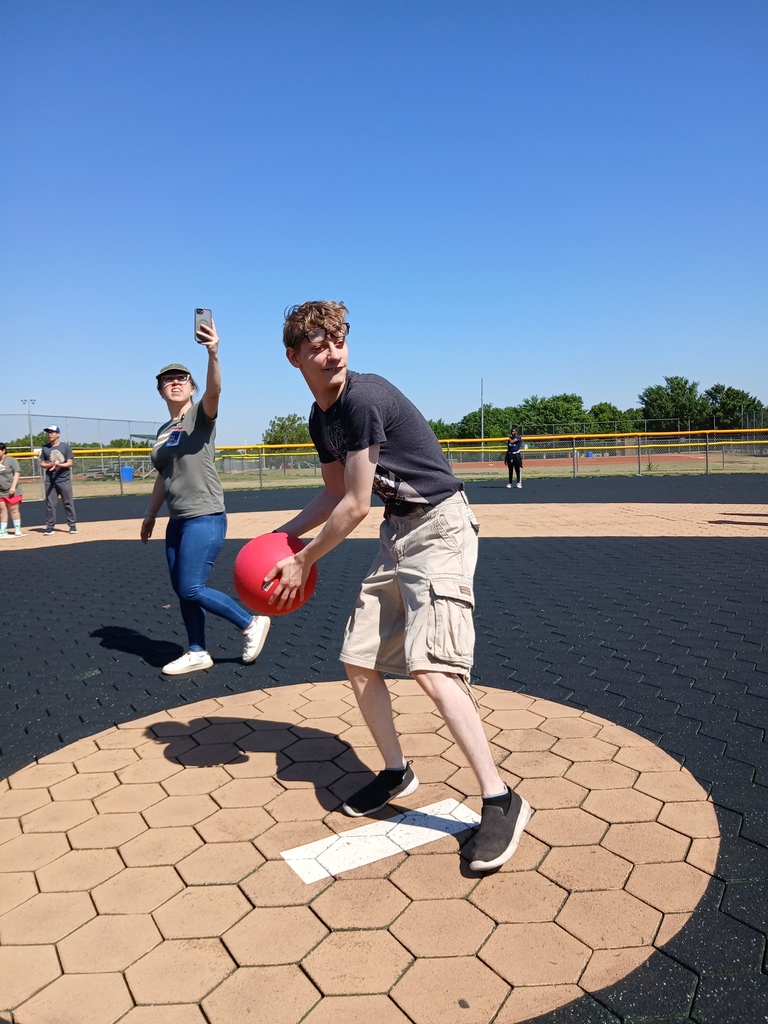An intern pitching the ball.