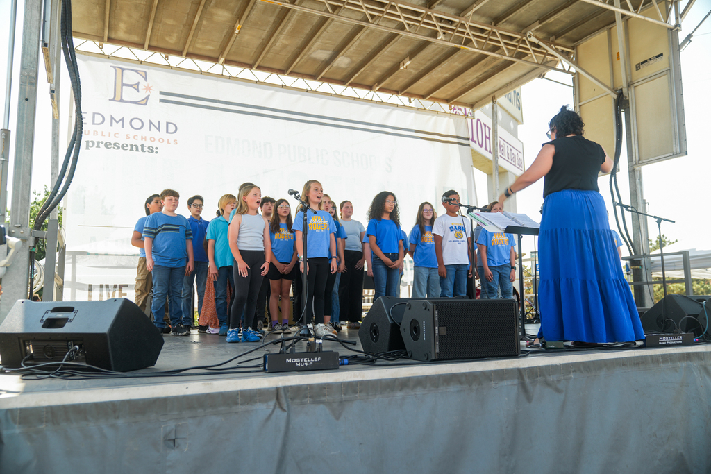 students performing on stage
