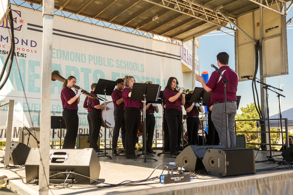 students performing on stage