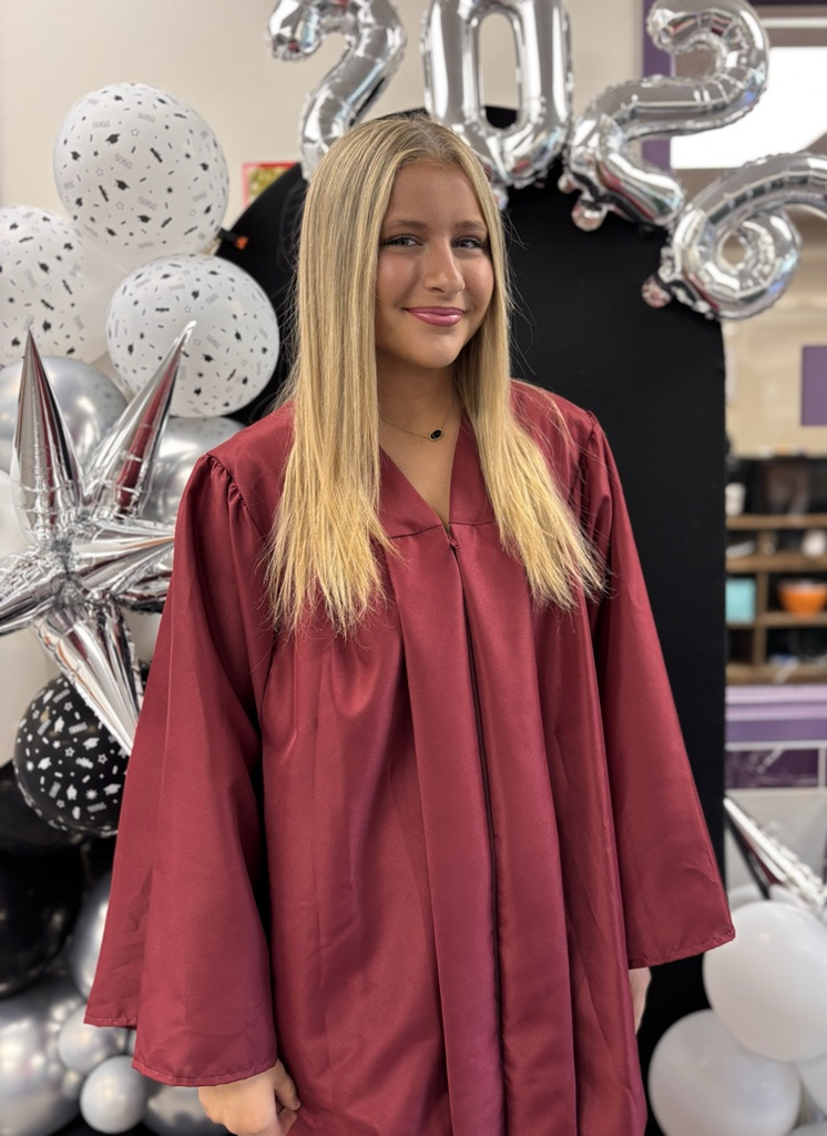 senior in front of 2026 backdrop 