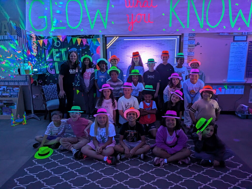 students reading in the dark for "Glow What You Know"