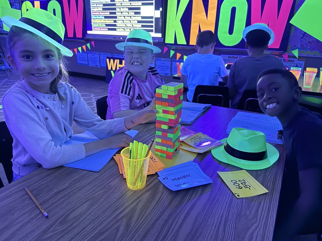 students reading in the dark for "Glow What You Know"