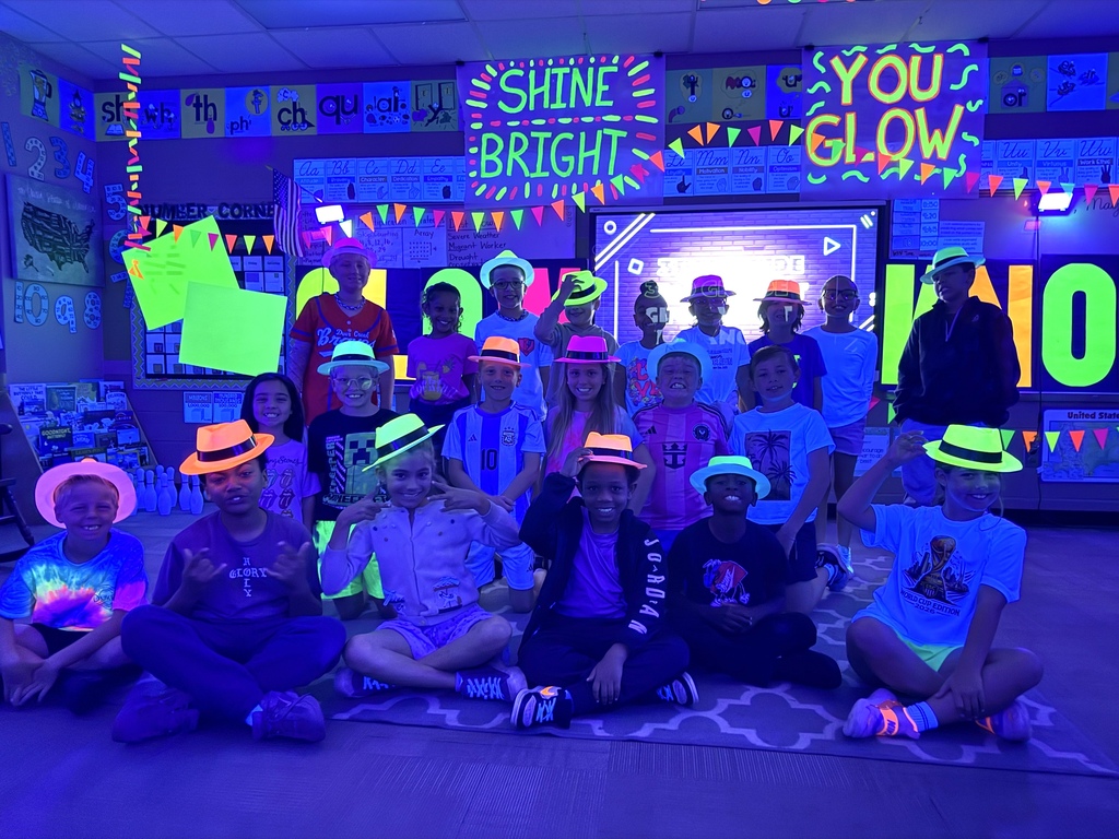 students reading in the dark for "Glow What You Know"