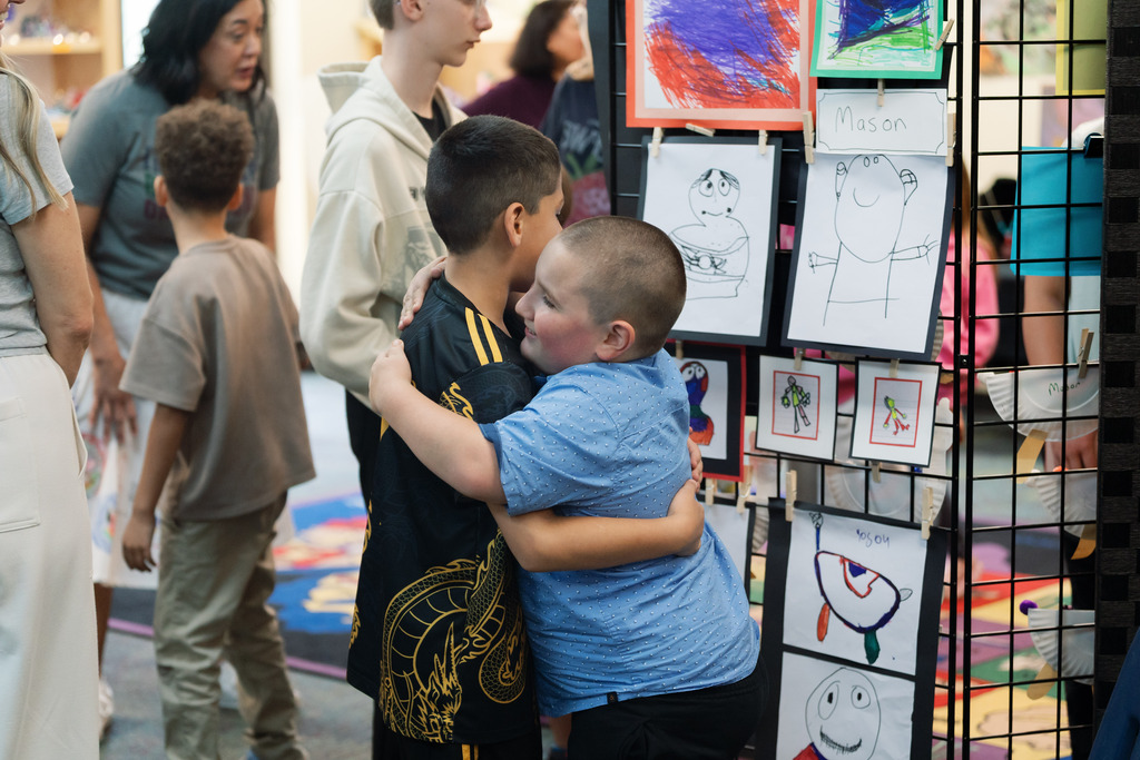students hugging