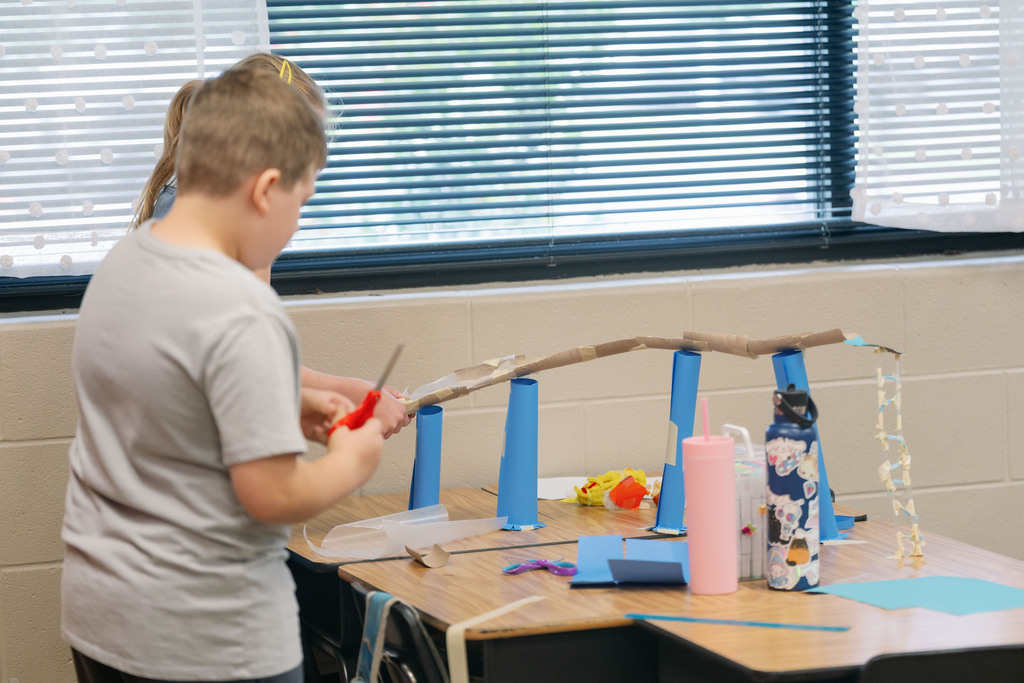 student working on a science project