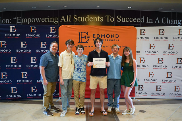 students standing with their awards