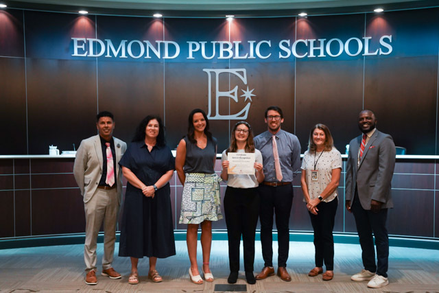 students standing with their awards