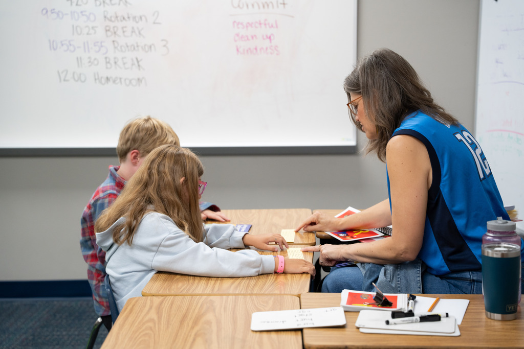 students and teacher working
