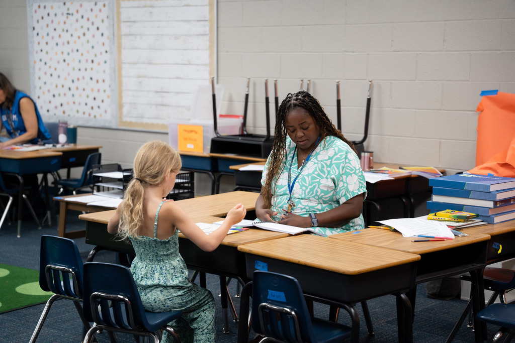 student and teacher working 1:1