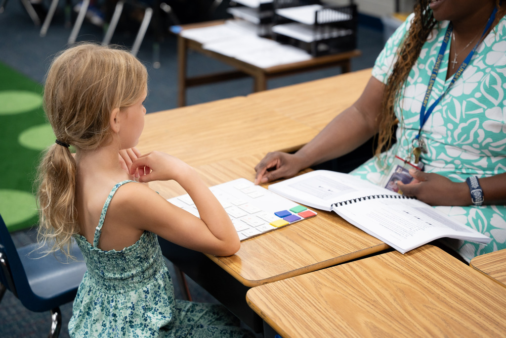 student and teacher working 1:1