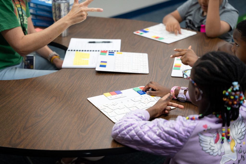 students and teacher working