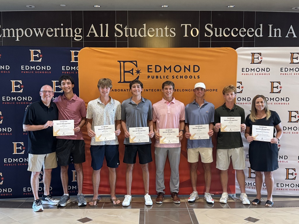 tennis team posing with awards