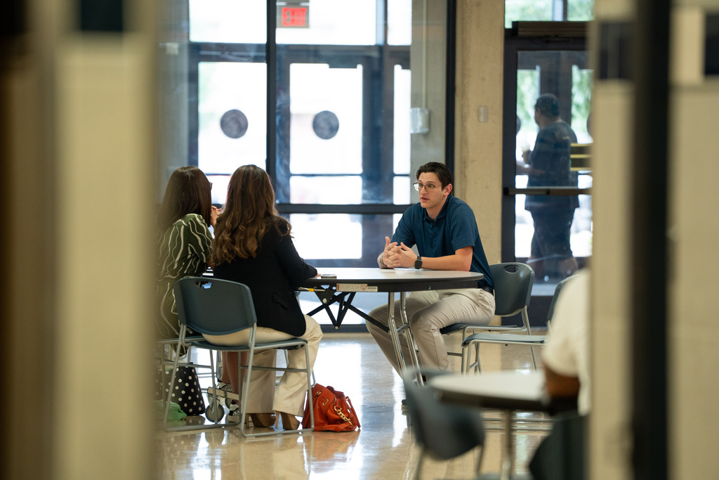 man talking to principals