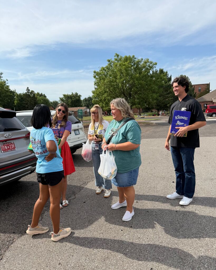 administrators doing acts of kindness around edmond