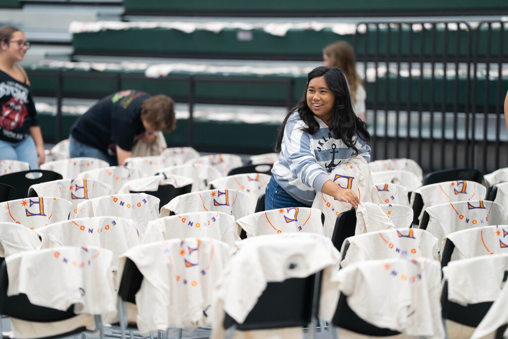 students helping distribute shirts