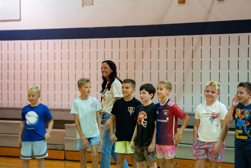board member and students smiling