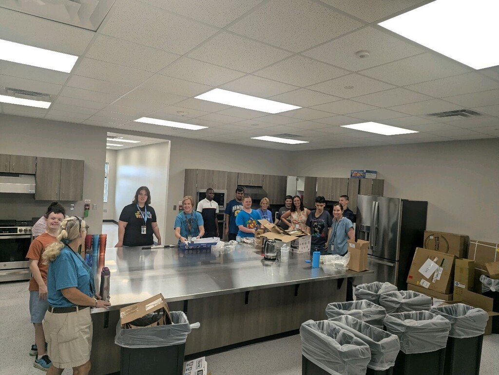 Interns organizing the new kitchen at ETA Scissortail.