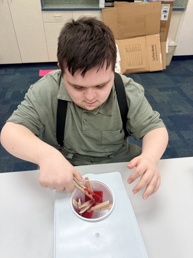 Intern working on a task box.
