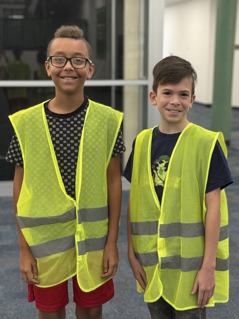 Two 5th grade boys in safty patrol vests