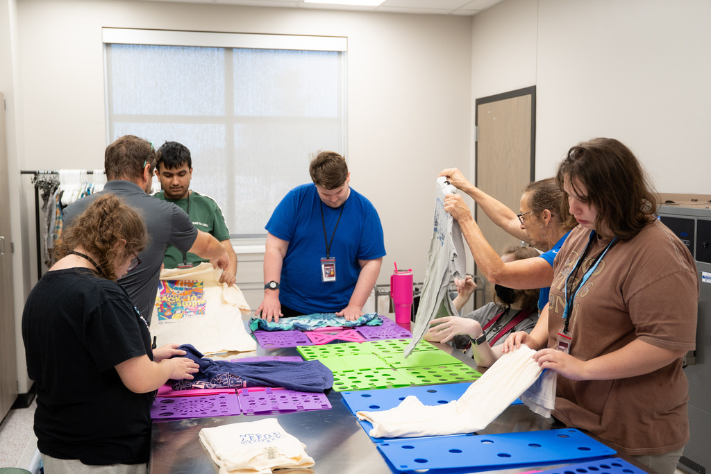 interns folding clothes