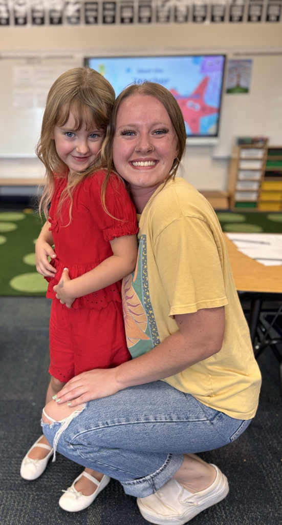 student and parent smiling 