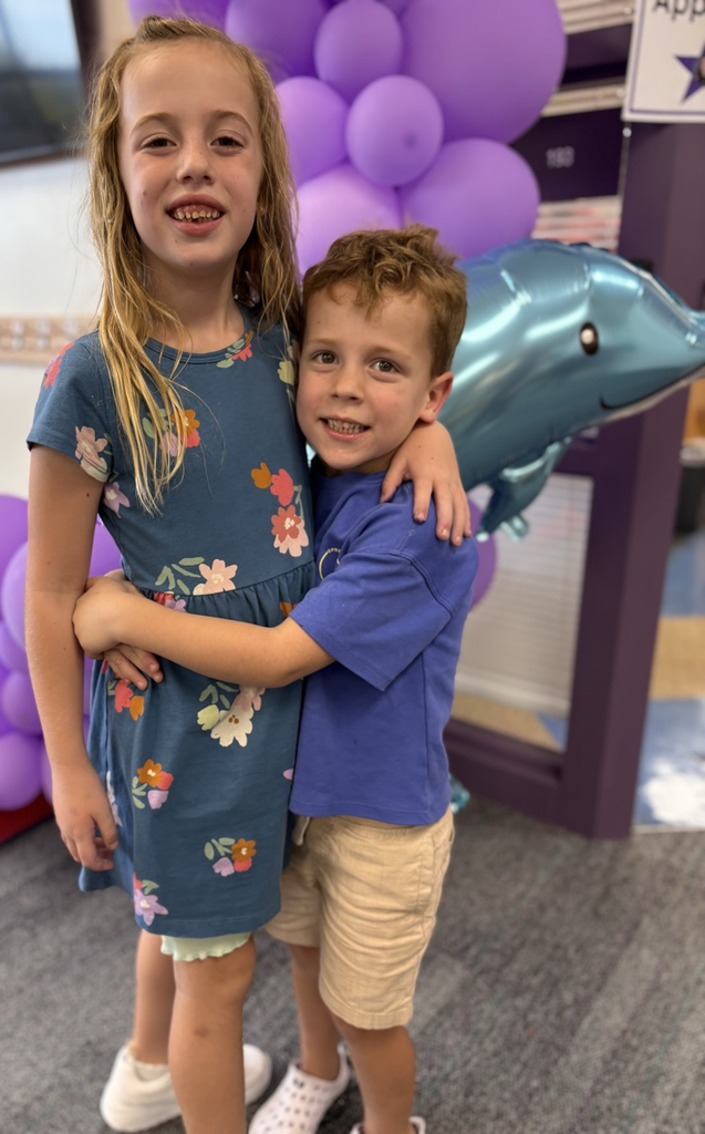 students hugging 