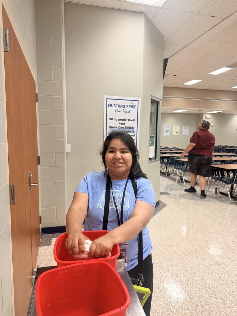 An intern helping cafeteria staff