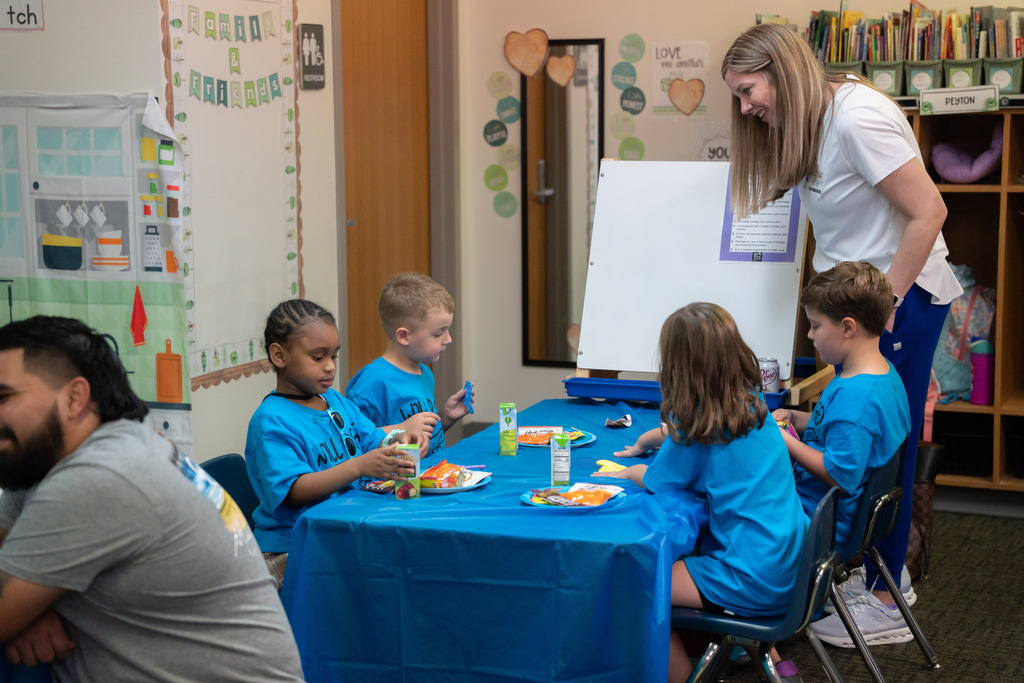 students eating snacks at a desk