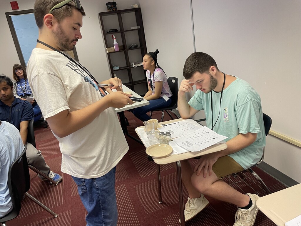 An intern practicing Table Service